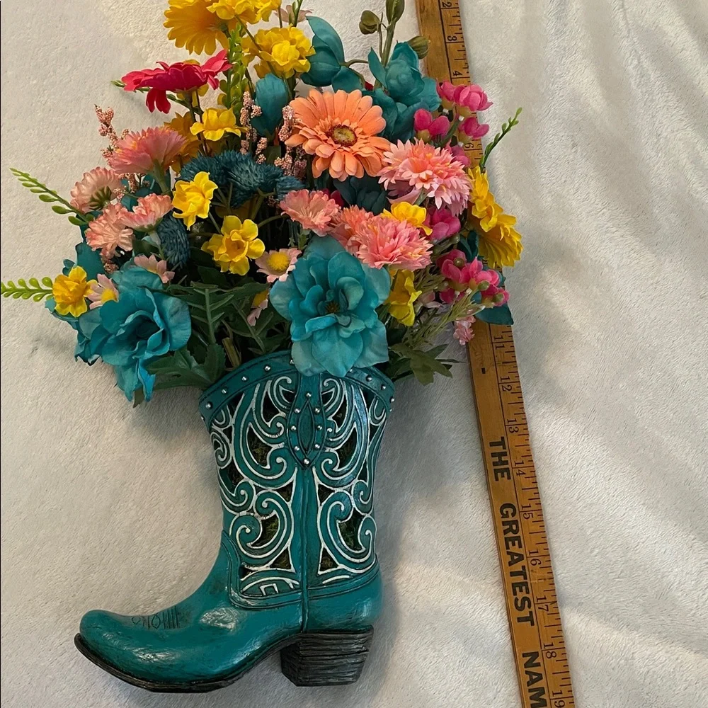 Cute colorful silk arrangement in a resin decorative boot. 🌺